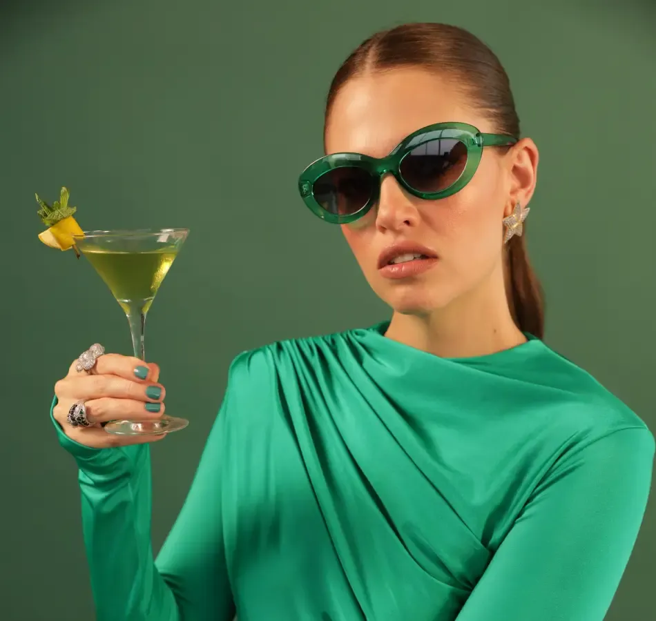 Fashionable Woman Enjoying A Gardenista Cocktail