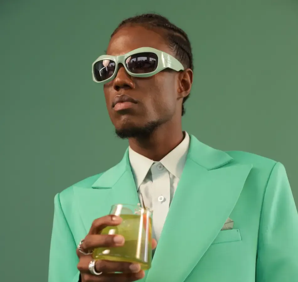 Man Drinking A Gardenista Cocktail